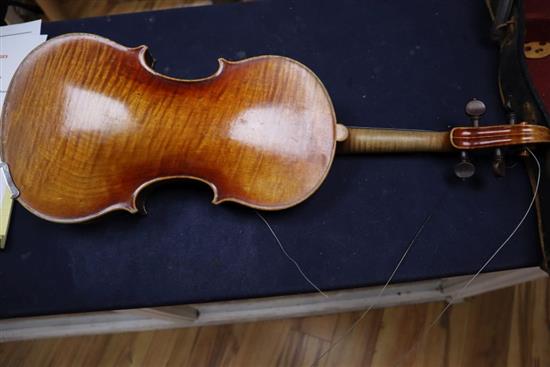 An early 20th century violin, bears label Paolo Fiorini, Taurini 1928, cased with a bow, single-piece back 36cm